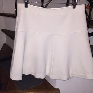 NWOT. Cream tennis skirt style w belling